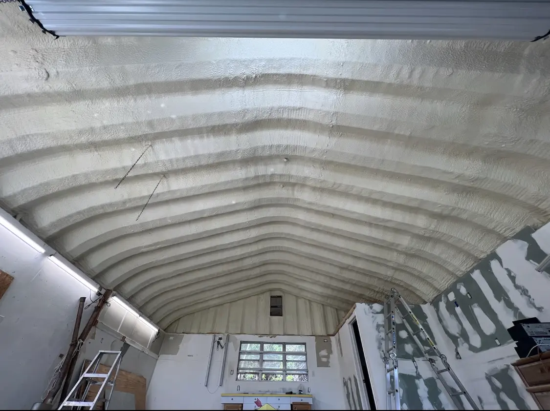 Spray polyurethane foam applied to the underside of a metal roof deck in Republic